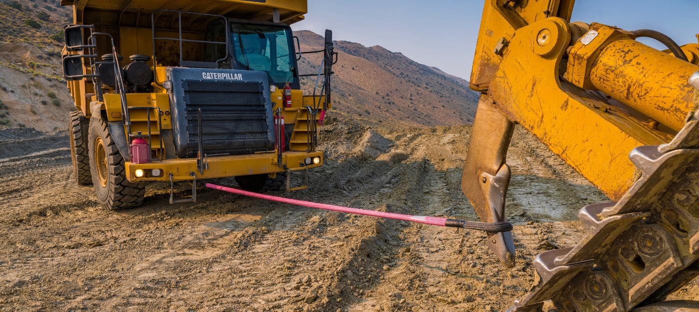 Samson Rope Panther Recovery Sling being used to recover a tractor in rugged terrain