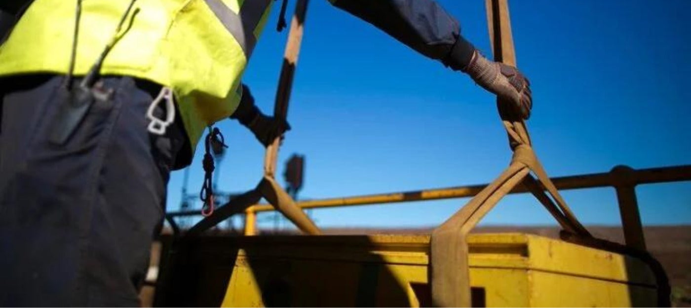 Man using a recovery sling at a mining facility