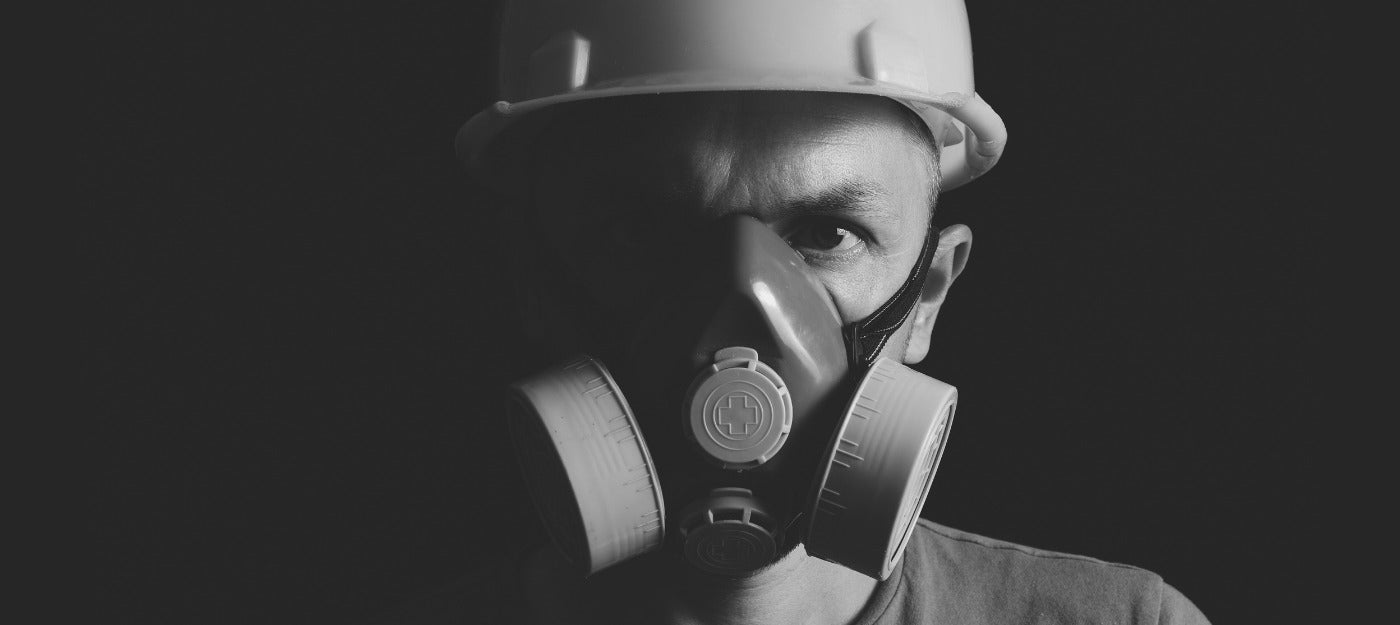 Miner wearing full face respirator